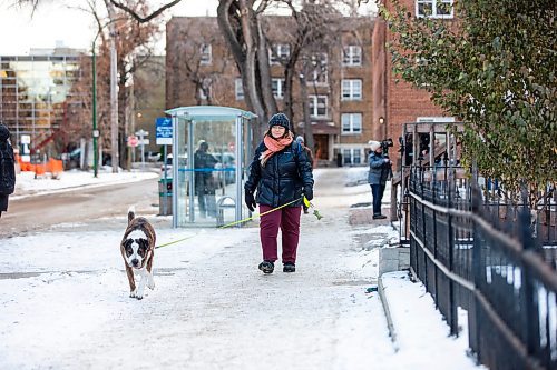 MIKAELA MACKENZIE / WINNIPEG FREE PRESS
	
Nathalie Kleinschmidt, who lives on the street and regularly walks her dog past the building, at 24 Carlton Street on Wednesday, Dec. 20, 2023. For Erik story.
Winnipeg Free Press 2023