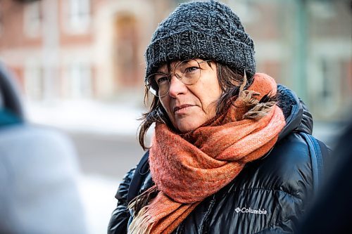 MIKAELA MACKENZIE / WINNIPEG FREE PRESS
	
Nathalie Kleinschmidt, who lives on the street and regularly walks her dog past the building, at 24 Carlton Street on Wednesday, Dec. 20, 2023. For Erik story.
Winnipeg Free Press 2023