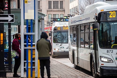 MIKAELA MACKENZIE / WINNIPEG FREE PRESS
	
Winnipeg Transit buses on Graham Avenue on Wednesday, Dec. 20, 2023. For transit series.
Winnipeg Free Press 2023