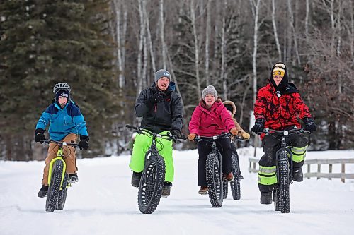 20122023
Visitors to Riding Mountain National Park ride fat bikes along a road in Wasagaming on a mild and quiet Wednesday in the park. 
(Tim Smith/The Brandon Sun)