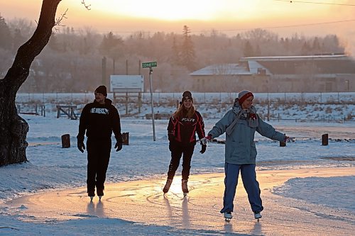 22122023
Ice skaters glide along the ice at the Brandon Skating Oval at sunset on Friday. After a mild start to winter, the oval opened to the public Thursday. 
(Tim Smith/The Brandon Sun)