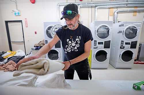 RUTH BONNEVILLE / WINNIPEG FREE PRESS

Local -  N'Dinawemak 

Feature pm  N'Dinawemak &#x2014; Our Relatives' Place at 190 Disraeli Freeway and some of their clients that have become volunteers at the centre.  

Photo of client, Jason Kennedy, who volunteers his time doing laundry for the centre,  

Feature by Niigaan 

Dec 21st,  2023