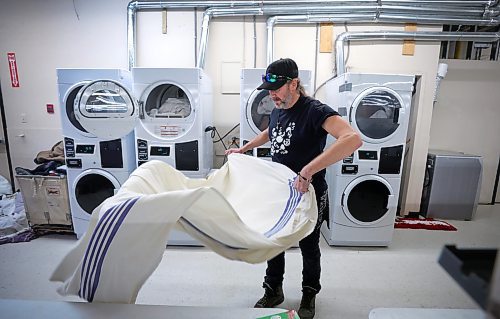 RUTH BONNEVILLE / WINNIPEG FREE PRESS

Local -  N'Dinawemak 

Feature pm  N'Dinawemak &#x2014; Our Relatives' Place at 190 Disraeli Freeway and some of their clients that have become volunteers at the centre.  

Photo of client, Jason Kennedy, who volunteers his time doing laundry for the centre,  

Feature by Niigaan 

Dec 21st,  2023