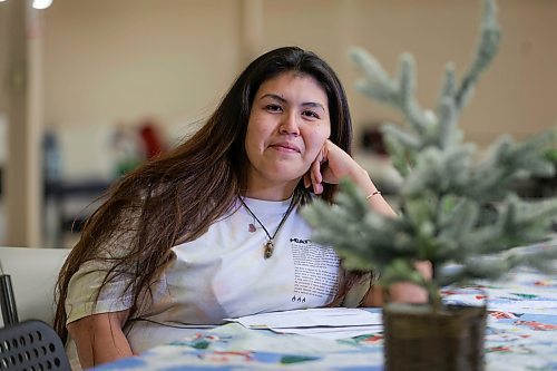 RUTH BONNEVILLE / WINNIPEG FREE PRESS

Local -  N'Dinawemak 

Feature pm  N'Dinawemak &#x2014; Our Relatives' Place at 190 Disraeli Freeway and some of their clients that have become volunteers at the centre.  

Portrait of Kyla Ouskun, who volunteers her time cleaning washrooms and helping out wherever she can at the centre,  

Photo taken upstairs, in the women's dormitory as she enjoys dressing a small, tabletop, Christmas tree decoration on their dining table in their dormitory Thursday. 
 
Feature by Niigaan 

Dec 21st,  2023