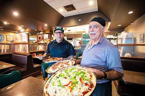 MIKAELA MACKENZIE / WINNIPEG FREE PRESS
	
One of the new owners Justin Scheffer (left) and founder John at Johnny's Maples Pizza on Friday, Dec. 22, 2023. For Dave story.
Winnipeg Free Press 2023