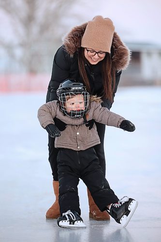 22122023
Two-year-old Brooks Hamm practices his skating with help from his mom Ashley at the Brandon Skating Oval on Friday. After a mild start to winter the oval opened to the public Thursday. 
(Tim Smith/The Brandon Sun)