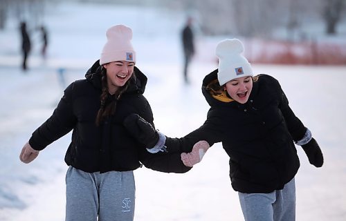 22122023
Friends Mya Lindenberg and Ella Vandaele laugh while skating at the Brandon Skating Oval on Friday. After a mild start to winter the oval opened to the public Thursday. 
(Tim Smith/The Brandon Sun)