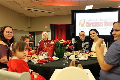 The Clyne family enjoys the holiday meal--their first outing back to the dinner since the pandemic. (Geena Mortfield/The Brandon Sun)