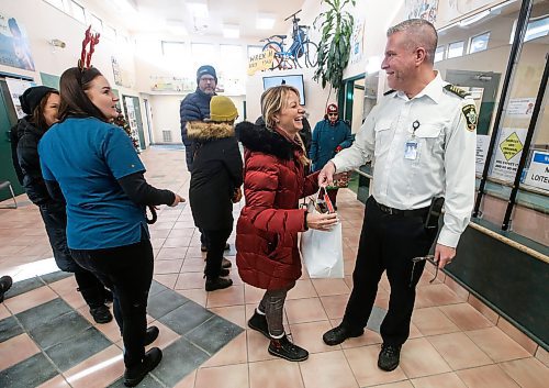 JOHN WOODS / WINNIPEG FREE PRESS
Animal Services General Manager Leland Gordon accepts some donations as people visit an open house at the Animal Services as in Winnipeg Monday, December  25, 2023. 

Reporter: standup