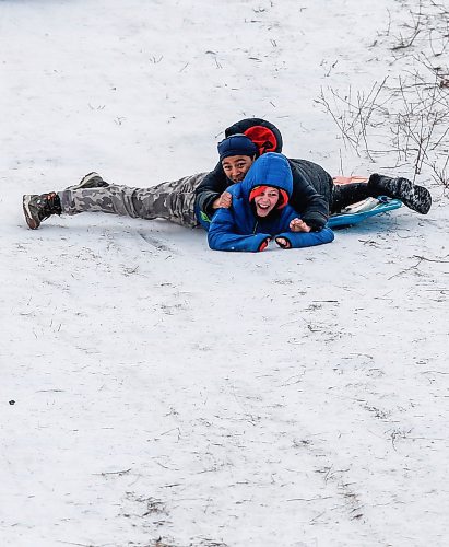 JOHN WOODS / WINNIPEG FREE PRESS
Friends Mavo, front, and Jaiden slide down Garbage Hill at Westvew Park in Winnipeg Tuesday, December  26, 2023. 

Reporter: standup