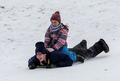 JOHN WOODS / WINNIPEG FREE PRESS
Siblings Nick and Alice slide down Garbage Hill at Westvew Park in Winnipeg Tuesday, December  26, 2023. 

Reporter: standup