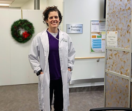 Sharla Bouchard, radiation therapist at the Western Manitoba Cancer Centre (WMCC), recent recipient of a provincial award recognizing excellence at work and commitment to her community, stands at the entrance of the radiation therapy unit in Brandon. (Michele McDougall/The Brandon Sun).
