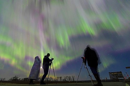 24042023
Photographers capture images of the northern lights as they dance across the sky above Highway 250 north of Alexander early Monday morning. 
(Tim Smith/The Brandon Sun)