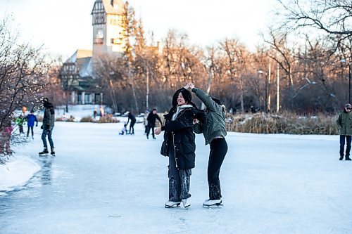MIKAELA MACKENZIE / WINNIPEG FREE PRESS
	
Luning Yang (left) and Stella Zhang dance together on the Assiniboine Park duck pond skating rink, which opened today, on Friday, Dec. 29, 2023.  Standup.
Winnipeg Free Press 2023