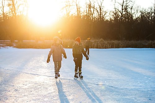 MIKAELA MACKENZIE / WINNIPEG FREE PRESS
	
Louis Stoezel (11, left) and August Fehr (11) skate on the Assiniboine Park duck pond skating rink, which opened today, on Friday, Dec. 29, 2023.  Standup.
Winnipeg Free Press 2023