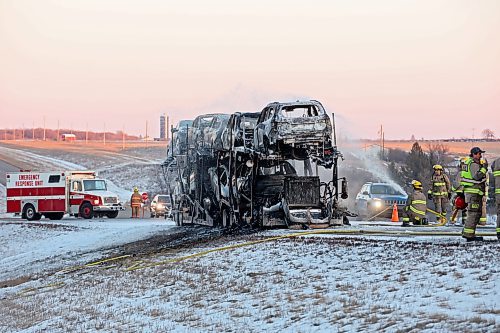 29122023
Firefighters extinguish a blaze after a semi trailer carrying cars caught fire in the westbound lanes of the Trans Canada Highway east of Carberry on Friday afternoon. The westbound lanes of the highway were briefly closed on Friday while firefighters battled the blaze. 
(Tim Smith/The Brandon Sun)