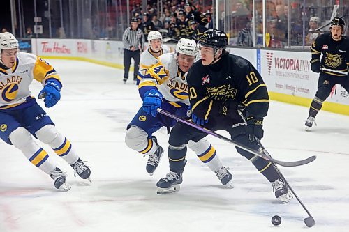 29122023
Caleb Hadland #10 of the Brandon Wheat Kings keeps the puck ahead of Charlie Wright #47 of the Saskatoon Blades for a goal during WHL action at Westoba Place on Friday evening. (Tim Smith/The Brandon Sun)