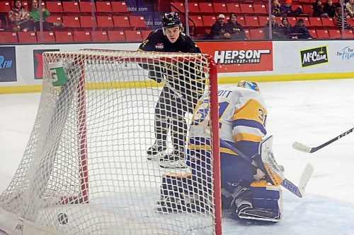 29122023
Jayden Wiens #14 of the Brandon Wheat Kings slips the puck past netminder Austin Elliott #31 of the Saskatoon Blades for a goal during WHL action at Westoba Place on Friday evening. (Tim Smith/The Brandon Sun)