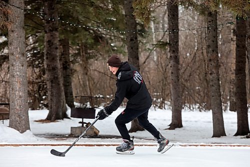 02012024
Reese Andres plays shinny with family at the skating rink and trail in Wasagaming on a mild Tuesday afternoon.
(Tim Smith/The Brandon Sun)