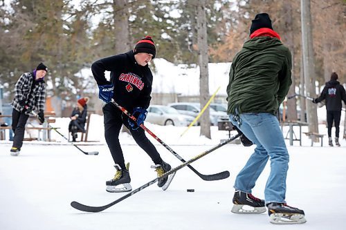 02012024
Hudson Andres and Danny Lee play shinny with family at the skating rink and trail in Wasagaming on a mild Tuesday afternoon.
(Tim Smith/The Brandon Sun)