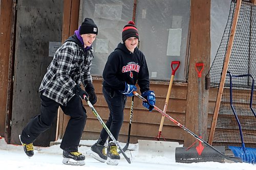 02012024
Jackson Lee and Hudson Andres play shinny with family at the skating rink and trail in Wasagaming.
(Tim Smith/The Brandon Sun)