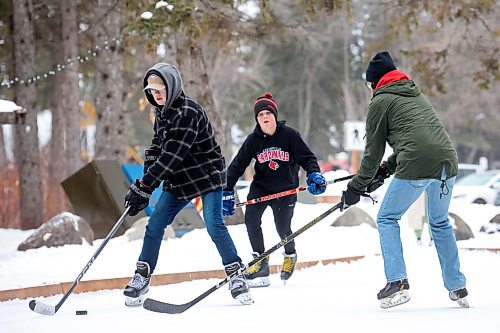 02012024
Maddox Andres, Hudson Andres, and Danny Lee play shinny with family at the skating rink and trail in Wasagaming on a mild Tuesday afternoon.
(Tim Smith/The Brandon Sun)