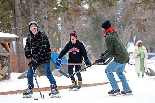 02012024
Maddox Andres, Hudson Andres, and Danny Lee play shinny with family at the skating rink and trail in Wasagaming on a mild Tuesday afternoon.
(Tim Smith/The Brandon Sun)