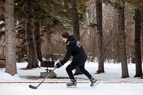 02012024
Reese Andres plays shinny with family at the skating rink and trail in Wasagaming on a mild Tuesday afternoon.
(Tim Smith/The Brandon Sun)