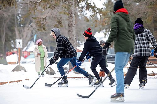 02012024
Maddox Andres, Hudson Andres, Danny Lee and Jackson Lee play shinny with family at the skating rink and trail in Wasagaming on a mild Tuesday afternoon.
(Tim Smith/The Brandon Sun)