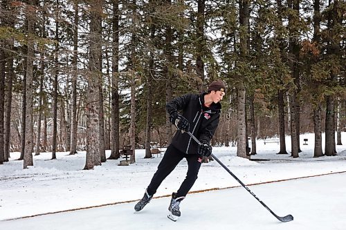 02012024
Reese Andres plays shinny with family at the skating rink and trail in Wasagaming on a mild Tuesday afternoon.
(Tim Smith/The Brandon Sun)