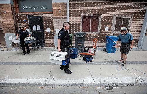 JOHN WOODS / WINNIPEG FREE PRESS
Thomas Williams, a resident, looks for his cats as Animal Services remove cats from the apartment building as people are evicted from 743 Sargent Ave. in Winnipeg, Monday, August  21, 2023. 

Reporter: ?