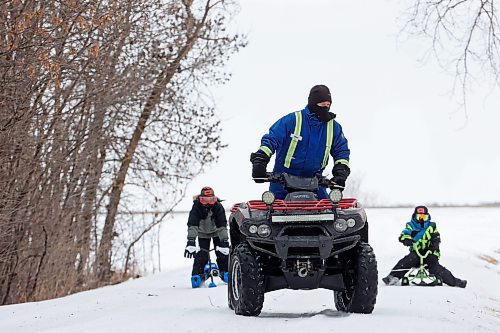 03012024
Ken Cory uses his quad to pull Theo Durnin and Jason Cory through the snow on sleds at the Corys' home near Wawanesa on a mild and overcast Wednesday.
(Tim Smith/The Brandon Sun)