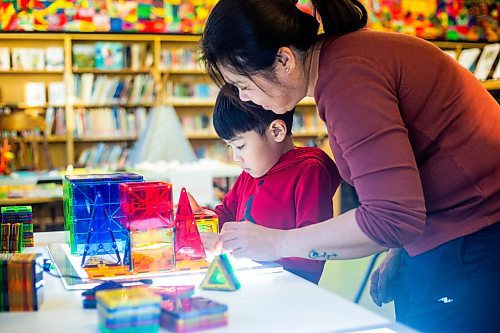 MIKAELA MACKENZIE / WINNIPEG FREE PRESS
	
Marites Lacson and her son, Jared Lacson (seven), take part in the Young Designer Program at Weston School on Wednesday, Dec. 13, 2023. For Maggie story.
Winnipeg Free Press 2023