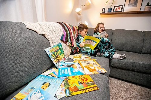 MIKAELA MACKENZIE / WINNIPEG FREE PRESS
	
Asher (eight, left), and Zev (six) Paul read books from the PJ Library (a program run by the Jewish Federation of Winnipeg which provides free books to Jewish families) at their home on Wednesday, Jan. 3, 2024.   For John Longhurst story.
Winnipeg Free Press 2023