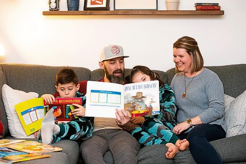 MIKAELA MACKENZIE / WINNIPEG FREE PRESS
	
Asher (eight, left), Ryan, Zev (six), and Amanda Paul read books from the PJ Library (a program run by the Jewish Federation of Winnipeg which provides free books to Jewish families) at their home on Wednesday, Jan. 3, 2024.   For John Longhurst story.
Winnipeg Free Press 2023