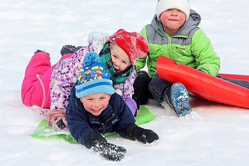 04012024
Barrett Peech, Anna Mahy and Roger Saban sled down the hill together at Victoria Park in Souris during an outing for kids at Souris Cooperative Daycare on Thursday. (Tim Smith/The Brandon Sun)