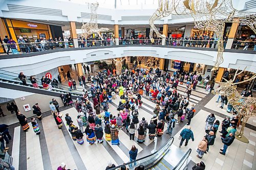 MIKAELA MACKENZIE / WINNIPEG FREE PRESS
	
The Soaring Eagle Singers lead a celebration song at Polo Park during an event marking the second annual National Ribbon Skirt Day on Thursday, Jan. 4, 2024.  Standup.
Winnipeg Free Press 2023