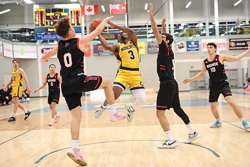 Khari Ojeda-Harvey (3) of the Brandon University Bobcats leaps to take a shot on the net during university basketball action against the University of Winnipeg Wesmen at the BU Healthy Living Centre on Friday evening. (Tim Smith/The Brandon Sun)