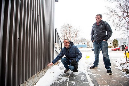 MIKAELA MACKENZIE / WINNIPEG FREE PRESS
	
Cal Dueck, Dueck Builders president (left), and Josh Friesen, Dueck Builders co-owner, show the parging line where concrete was poured to at a house they built (it was constructed when they were lobbying Lafarge to supply low-carbon concrete) on Friday, Jan. 5, 2024. Dueck Builders is among the first to adopt Lafarge Canada&#x573; low-carbon concrete, which comes as the industry tries to reduce its carbon footprint. For Gabby story.
Winnipeg Free Press 2023