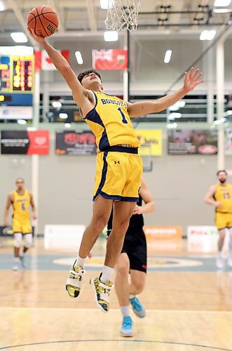 05012024
Travis Hamberger #1 of the Brandon University Bobcats leaps to take a shot on the net during university basketball action against the University of Winnipeg Wesmen at the BU Healthy Living Centre on Friday evening.
(Tim Smith/The Brandon Sun)