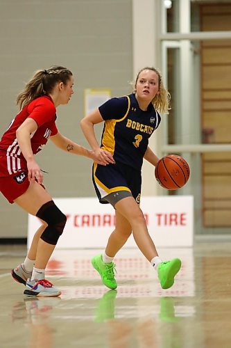 Brandon University Bobcats Piper Ingalls, right, dribbles against Winnipeg Wesmen Anna Kernaghan during their Canada West women's basketball game held at the Healthy Living Centre on Saturday. (Thomas Friesen/The Brandon Sun)