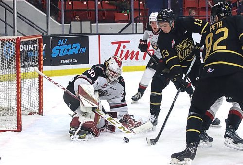 Vancouver Giants goalie Brett Mirwald (33) watches a rebound roll away as Brandon Wheat Kings forwards Roger McQueen (13) and Dominik Petr (82) converge on the puck under the watchful eye of defenceman Wyatt Wilson (5) during the second period of Vancouver's 4-0 win at Westoba Place on Saturday. (Perry Bergson/The Brandon Sun)
Jan. 6, 2024