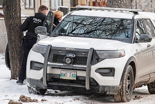 JOHN WOODS / WINNIPEG FREE PRESS
Police taken a person into custody as they investigate at 583 Furby after raiding 575 Furby in Winnipeg Sunday, January 7, 2024. 

Reporter: tyler