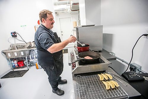 MIKAELA MACKENZIE / WINNIPEG FREE PRESS
	
Josh Penner, the chef and owner of Faspa Catering &amp; Food Market, makes Vareniki and Farmer Sausage at the new Mennonite take-out and catering business on Monday, Jan. 8, 2024. For Eva Wasney story.
Winnipeg Free Press 2023