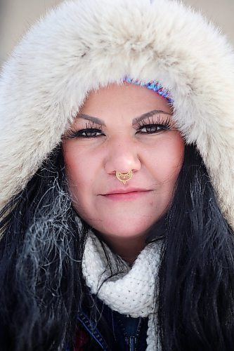 09012024
Jennifer Clyne keeps warm under a thick hood while walking along Rosser Avenue in downtown Brandon on Tuesday.
(Tim Smith/The Brandon Sun)