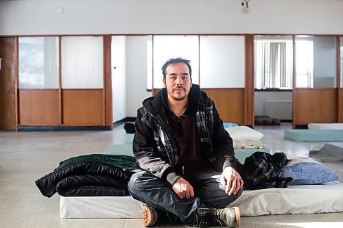 MIKAELA MACKENZIE / WINNIPEG FREE PRESS
	
Glenn Charles Robson sits on his mattress at the cold weather pop-up shelter run by St. Boniface Street Links at 604 St. Mary&#x573; Road on Tuesday, Jan. 9, 2024. For Nicole Buffie story.
Winnipeg Free Press 2023