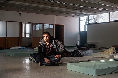 MIKAELA MACKENZIE / WINNIPEG FREE PRESS
	
Glenn Charles Robson sits on his mattress at the cold weather pop-up shelter run by St. Boniface Street Links at 604 St. Mary&#x573; Road on Tuesday, Jan. 9, 2024. For Nicole Buffie story.
Winnipeg Free Press 2023