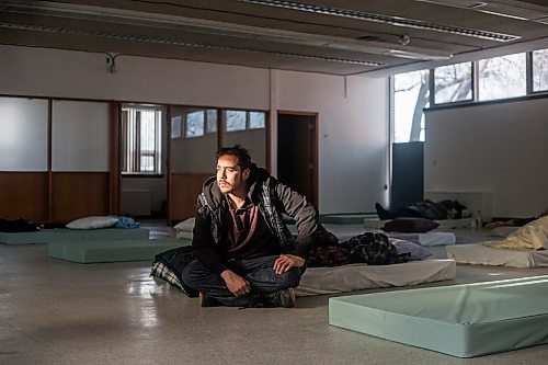 MIKAELA MACKENZIE / WINNIPEG FREE PRESS
	
Glenn Charles Robson sits on his mattress at the cold weather pop-up shelter run by St. Boniface Street Links at 604 St. Mary&#x573; Road on Tuesday, Jan. 9, 2024. For Nicole Buffie story.
Winnipeg Free Press 2023