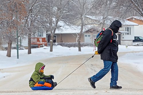 09012024
A man pulls a boy in a sled along Maryland Avenue on a bitterly cold Tuesday.
(Tim Smith/The Brandon Sun)