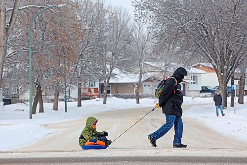 09012024
A man pulls a boy in a sled along Maryland Avenue on a bitterly cold Tuesday.
(Tim Smith/The Brandon Sun)